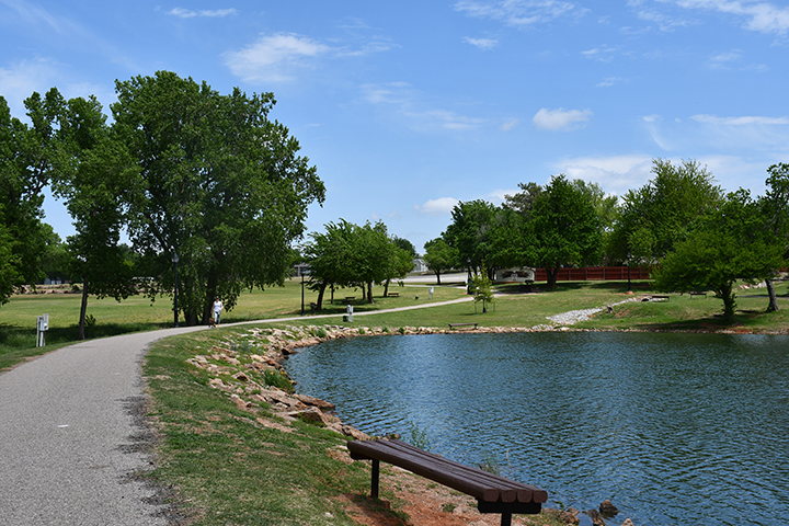 Paved walking trails lead around Mulvey Pond.
